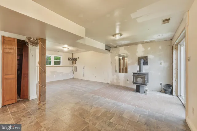 a view of a livingroom with furniture and a kitchen