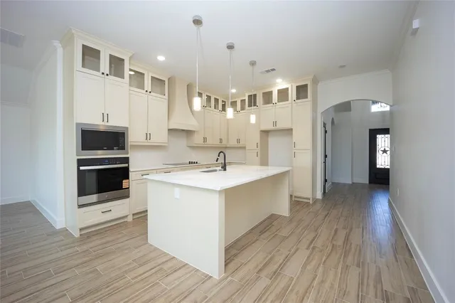 a view of kitchen with cabinets and wooden floor