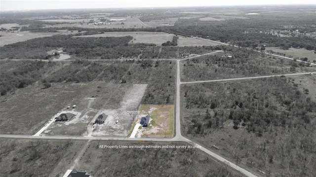 an aerial view of grey house