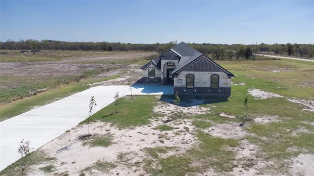 a house with trees in the background