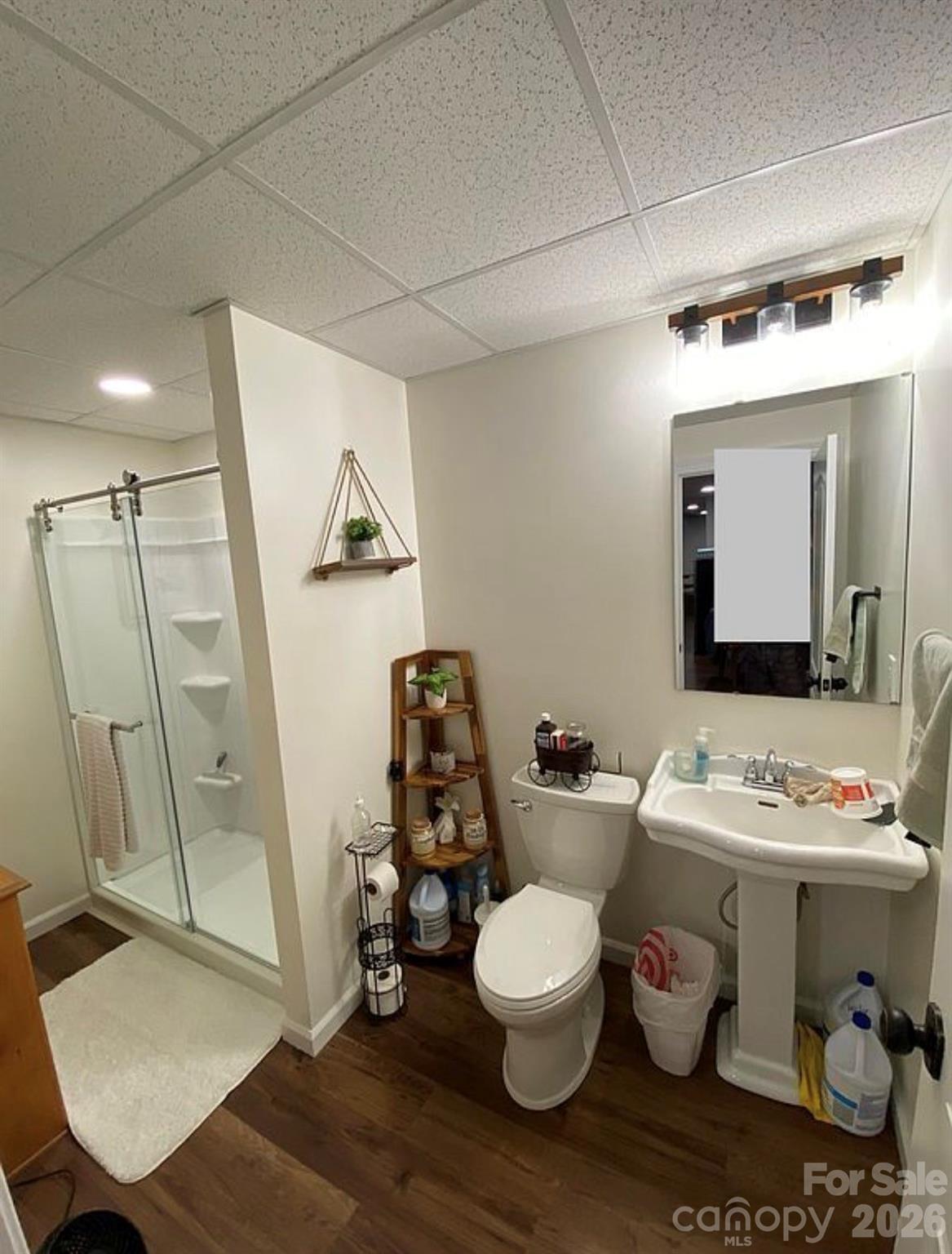 6042 Heavner Road Vale, NC 28168 - Photo 17 of 27 a bathroom with a toilet sink and mirror