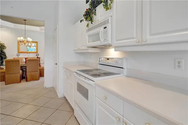 a kitchen with cabinets and appliances
