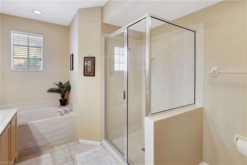 23156 Rosedale Drive, Unit 201 Estero, FL 34135 - Photo 22 of 50 a bathroom with a shower and a sink