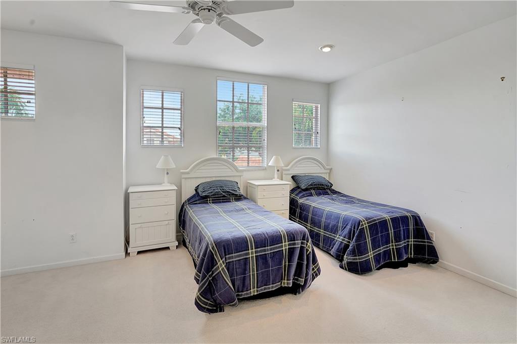 23156 Rosedale Drive, Unit 201 Estero, FL 34135 - Photo 24 of 50 a bedroom with two beds and windows