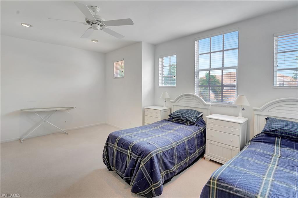 23156 Rosedale Drive, Unit 201 Estero, FL 34135 - Photo 26 of 50 a bedroom with a bed and window