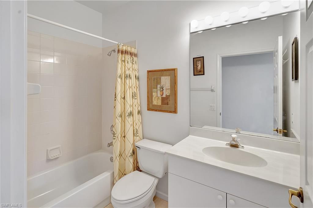 23156 Rosedale Drive, Unit 201 Estero, FL 34135 - Photo 28 of 50 a bathroom with a sink toilet and shower