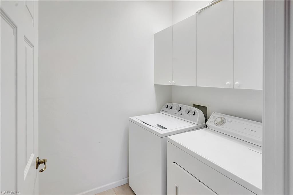 23156 Rosedale Drive, Unit 201 Estero, FL 34135 - Photo 29 of 50 a utility room with dryer and washer