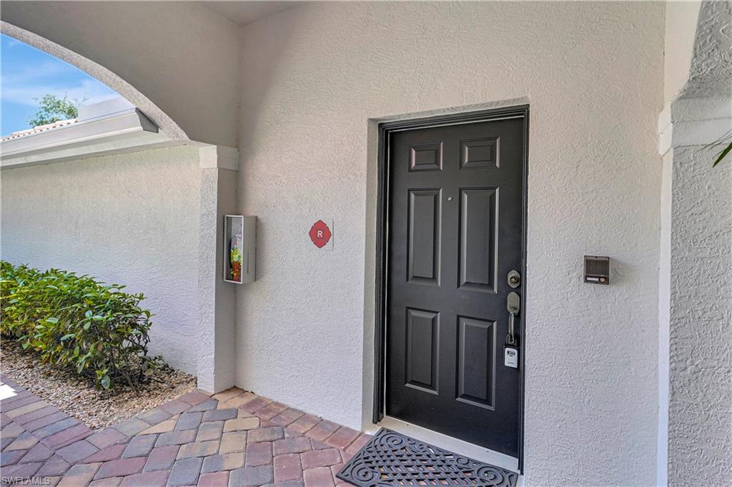 23156 Rosedale Drive, Unit 201 Estero, FL 34135 - Photo 3 of 50 a bathroom with a sink and a mirror
