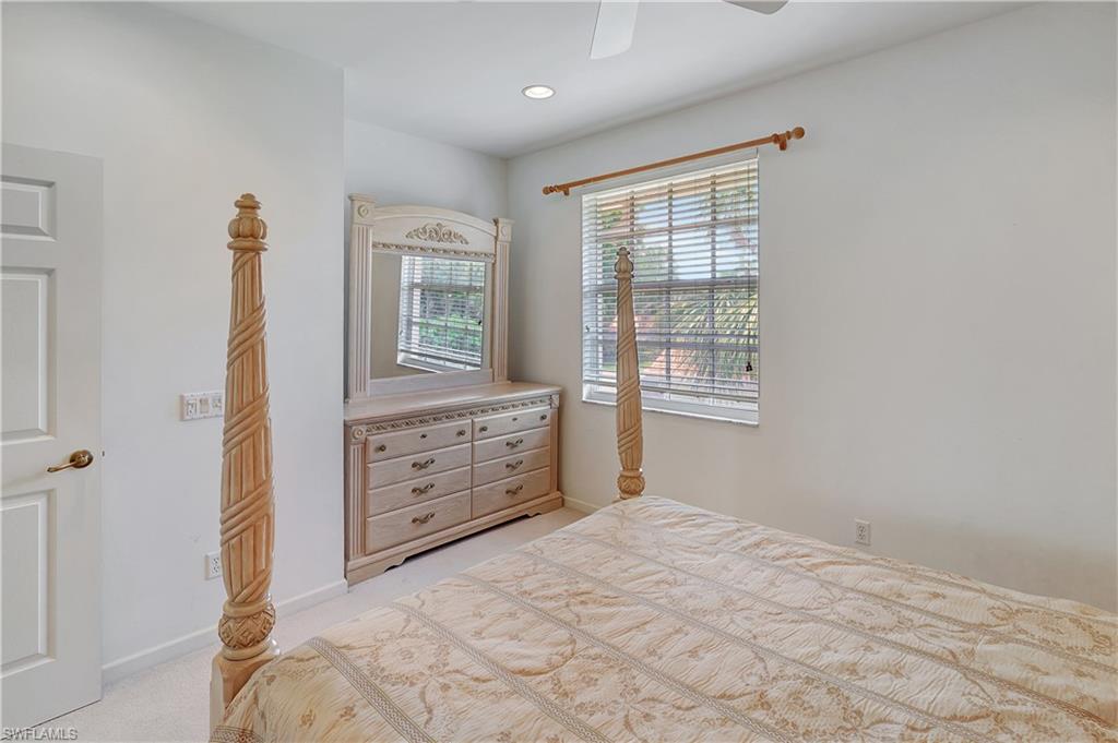 23156 Rosedale Drive, Unit 201 Estero, FL 34135 - Photo 31 of 50 a bedroom with a bed and a window