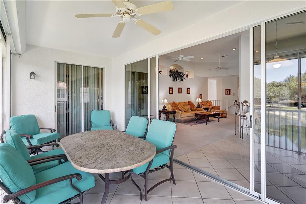 23156 Rosedale Drive, Unit 201 Estero, FL 34135 - Photo 36 of 50 a living room with furniture and a large window