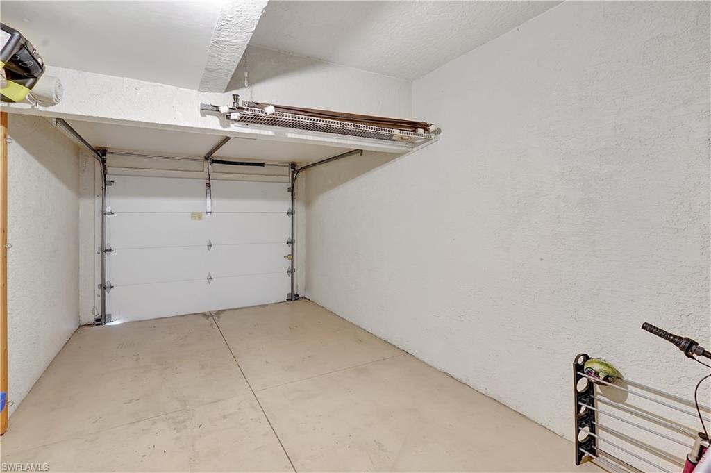 23156 Rosedale Drive, Unit 201 Estero, FL 34135 - Photo 39 of 50 a view of a garage