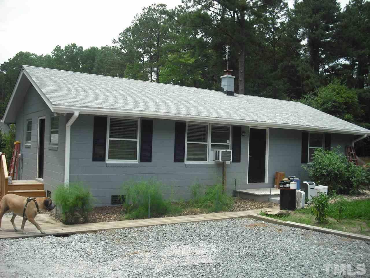 10905 Six Forks Road Raleigh, NC 27614 - Photo 1 of 5 a front view of a house with garden