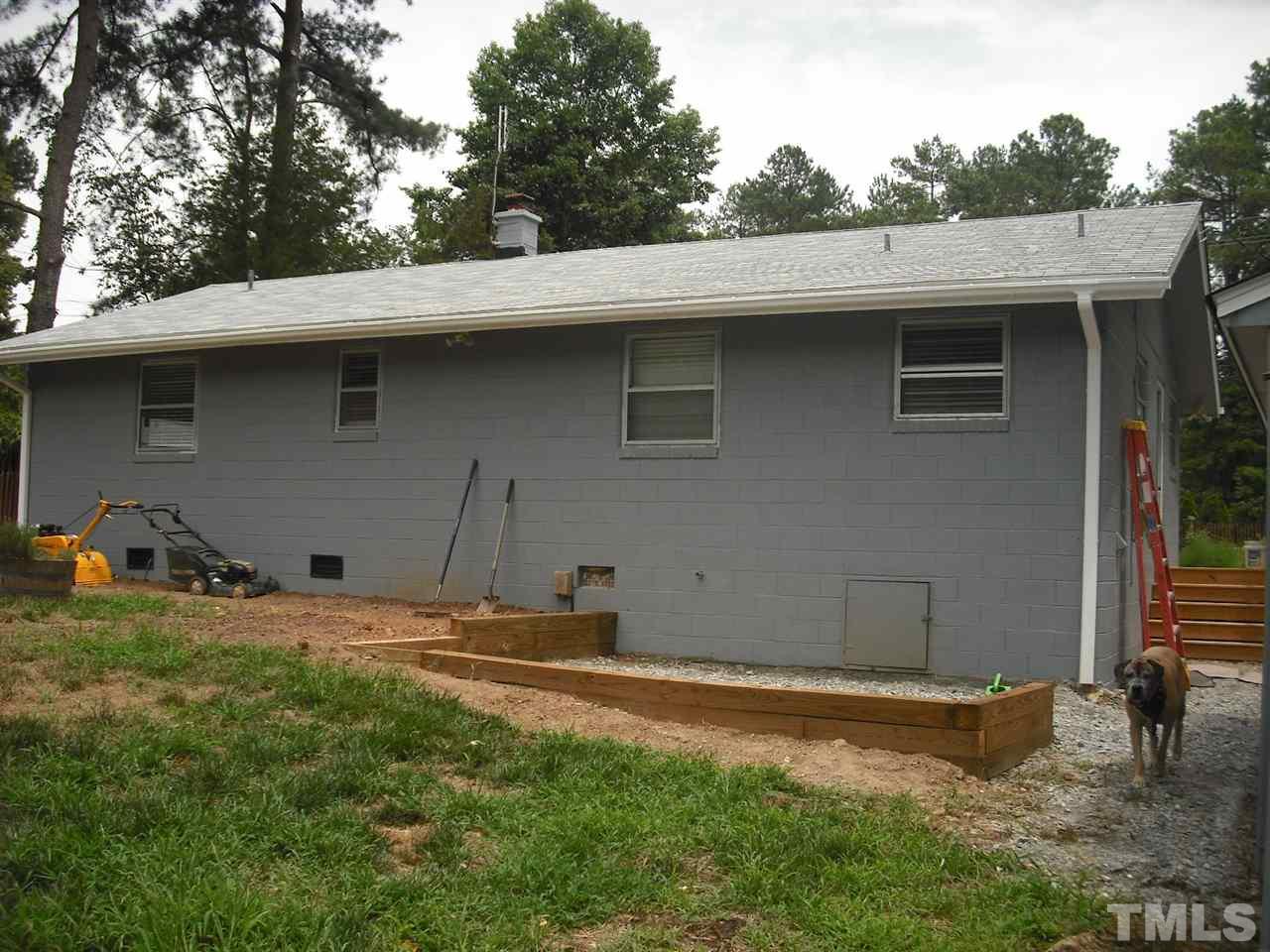 10905 Six Forks Road Raleigh, NC 27614 - Photo 2 of 5 a backyard of a house with lots of green space