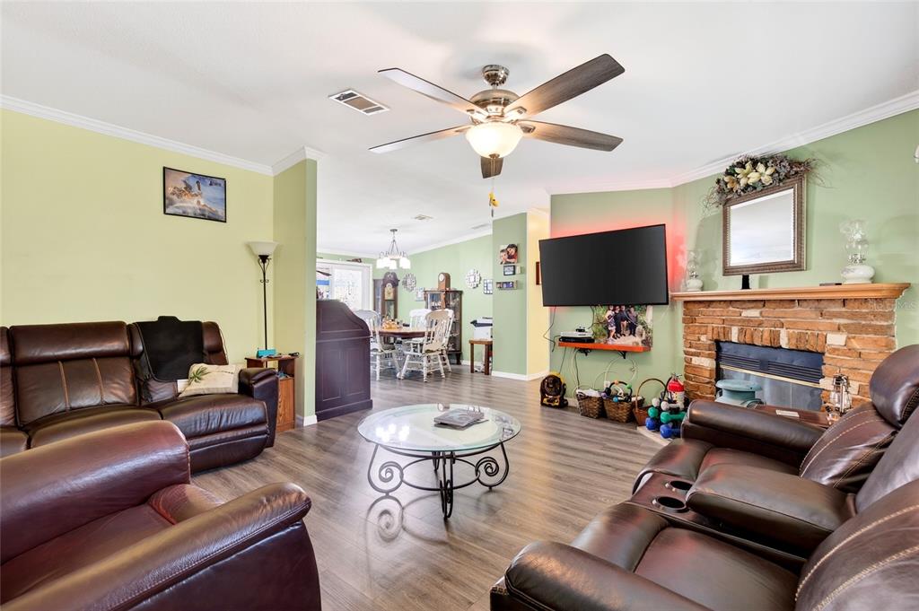 15340 Northwest 65th Avenue Road Reddick, FL 32686 - Photo 13 of 45 a living room with furniture and a flat screen tv