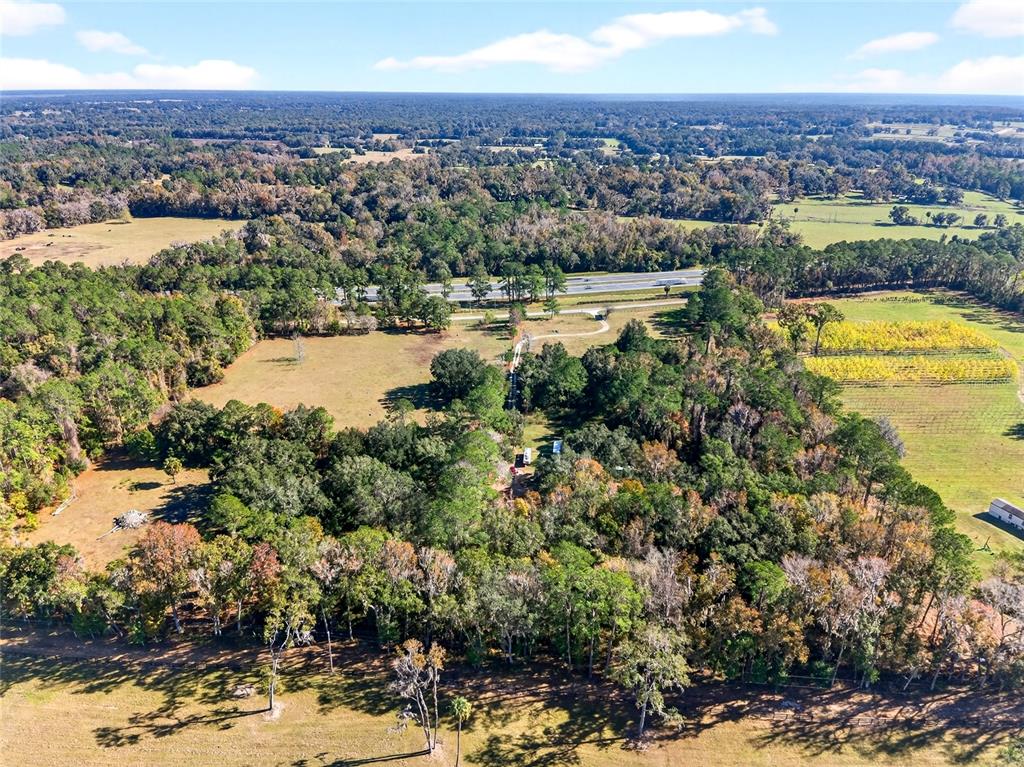 15340 Northwest 65th Avenue Road Reddick, FL 32686 - Photo 29 of 45 a view of a city with mountains in the background