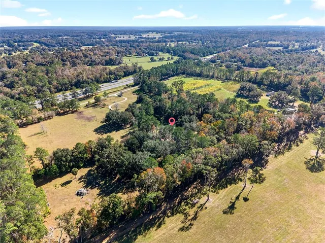 a view of a swimming pool with an outdoor space and seating area