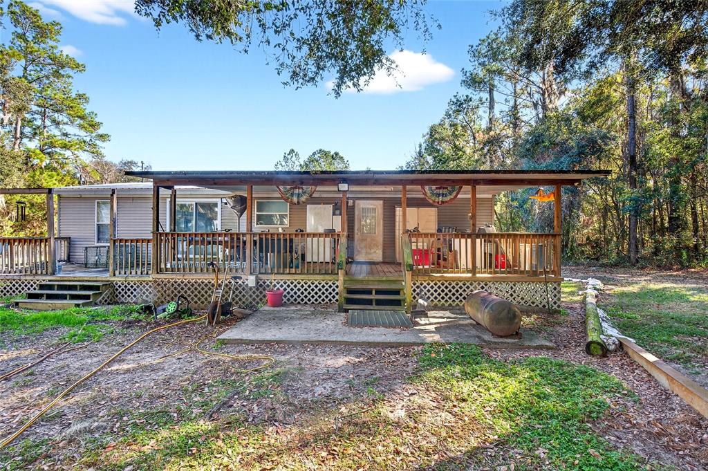 15340 Northwest 65th Avenue Road Reddick, FL 32686 - Photo 4 of 45 a house view with a garden space