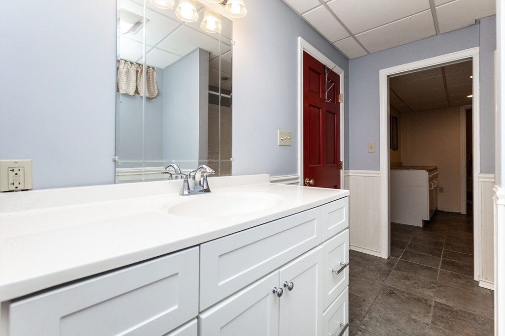 63 Bow Street Saugus, MA 01906 - Photo 29 of 42 a bathroom with a sink and a mirror