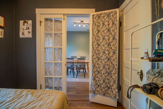 a bedroom with a bed and a cabinet