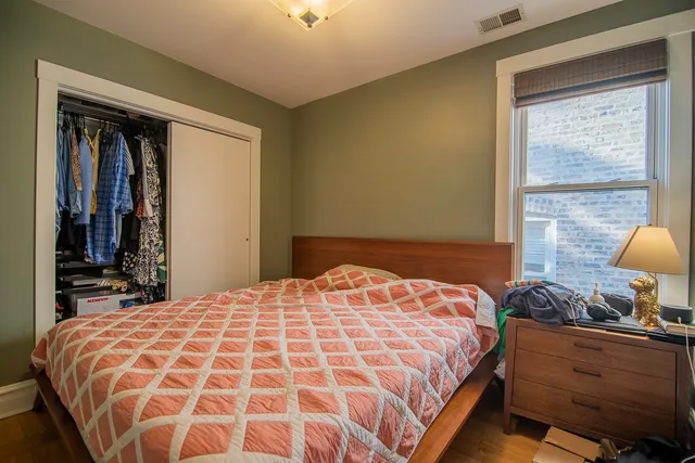 a view of a livingroom with furniture and a window