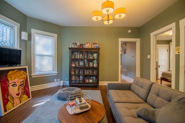 a bedroom with a bed and a table in it