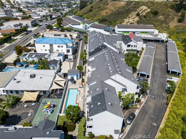 an aerial view of a house with a yard