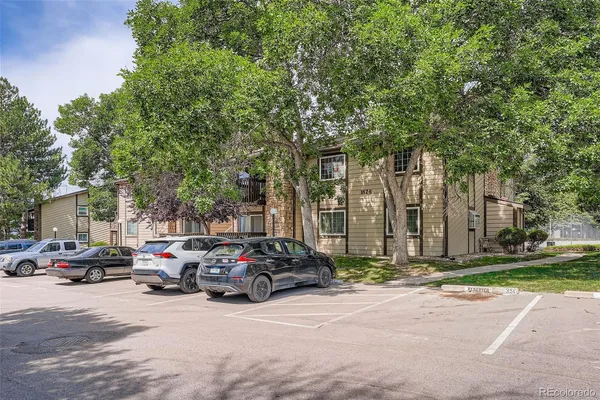 a parked cars parked in front of a building
