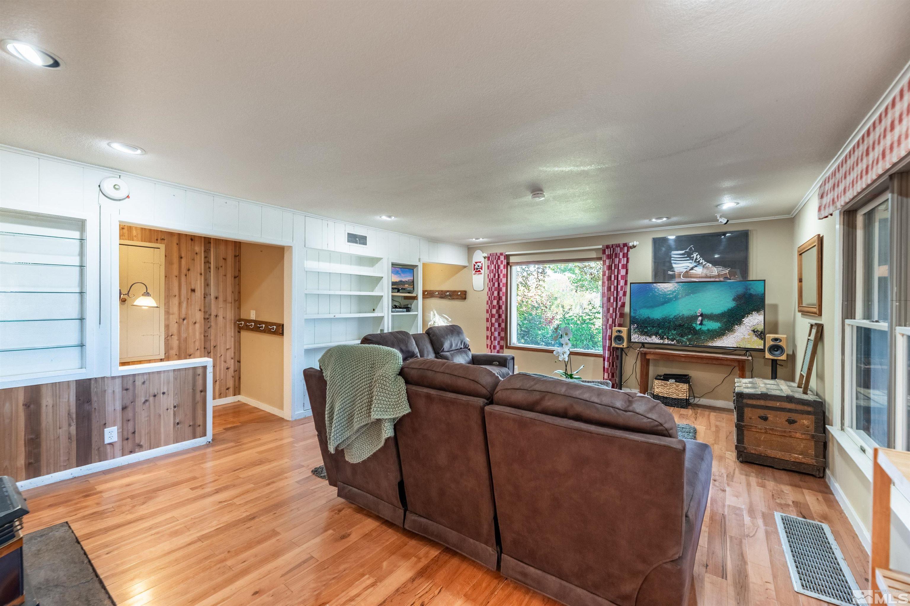 4000 Lone Tree Lane Reno, NV 89511 - Photo 12 of 39 a living room with furniture and a flat screen tv