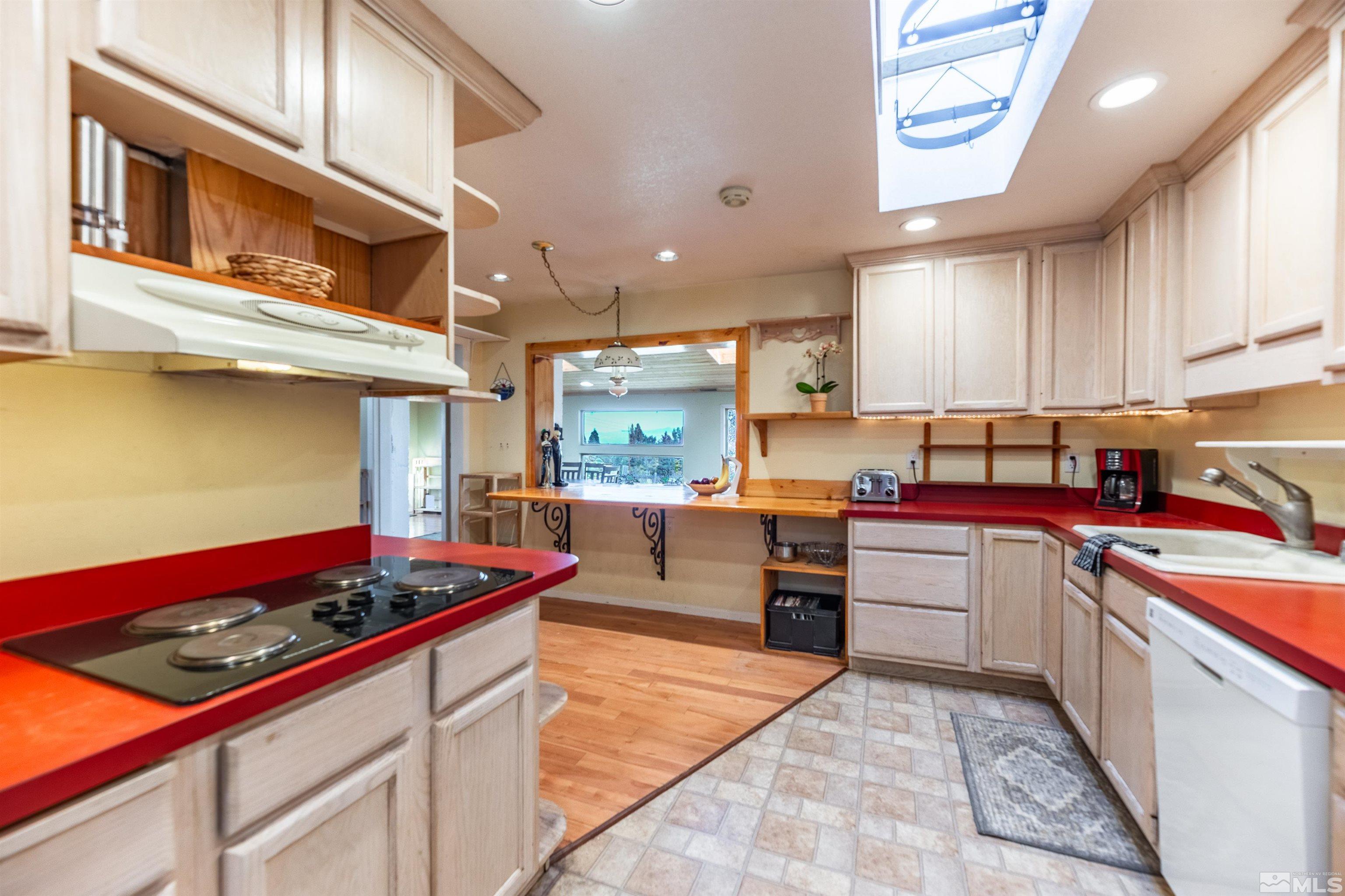 4000 Lone Tree Lane Reno, NV 89511 - Photo 9 of 39 a kitchen with stainless steel appliances granite countertop a stove and a sink