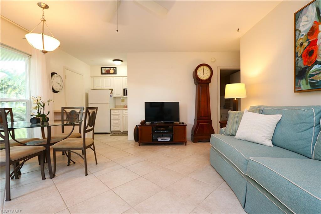235 Seaview Court, Unit B5 Marco Island, FL 34145 - Photo 4 of 23 a living room with furniture and a flat screen tv
