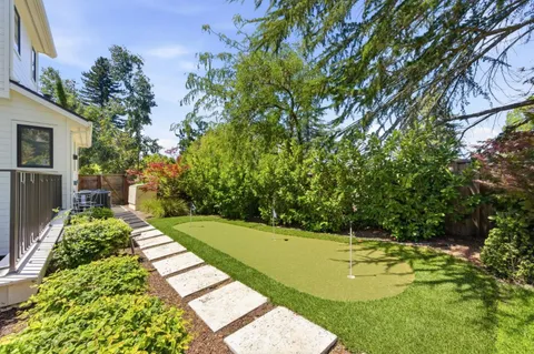 an aerial view of a house with a garden