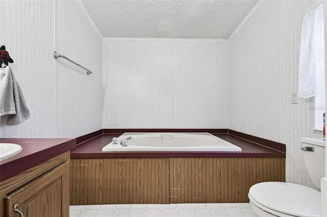 a view of a bathroom with a shower and a sink