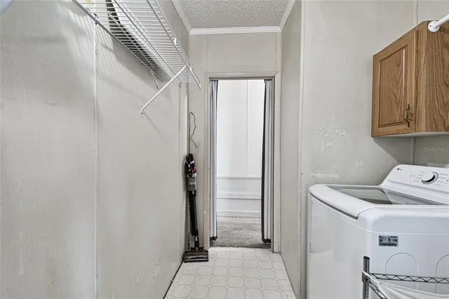 a kitchen with stainless steel appliances a sink cabinets and wooden floor