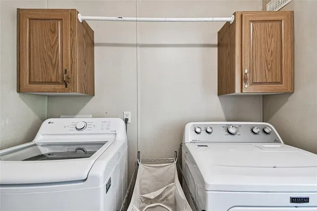 a kitchen with stainless steel appliances a sink cabinets and a refrigerator