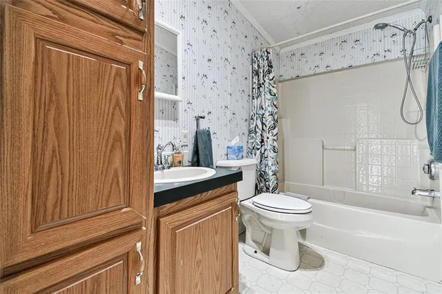 a kitchen with a stove top oven sink and cabinets