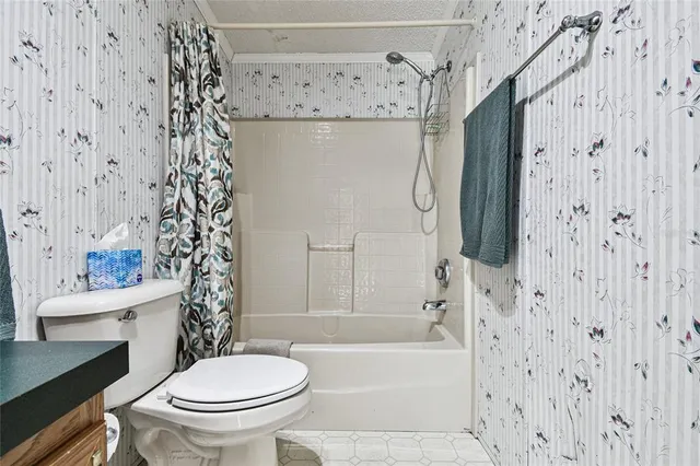 a kitchen with stainless steel appliances granite countertop a sink stove cabinets and wooden floor