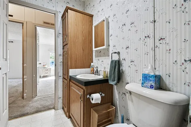 a kitchen with stainless steel appliances a stove microwave and cabinets