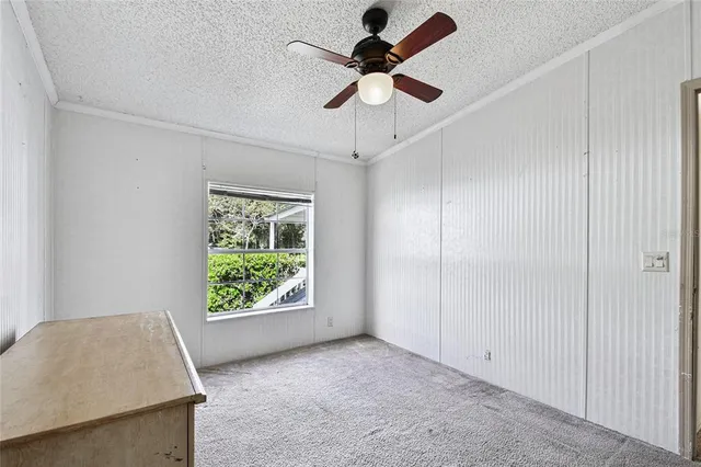 a bed room with a bed and a chandelier