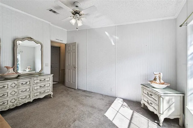 a view of a patio with a table chairs and wooden floor