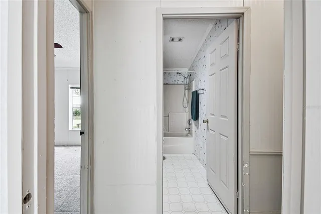 a dining room with wooden floor glass table and chairs