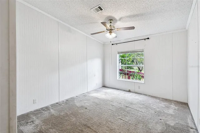 a view of a porch with furniture and a yard