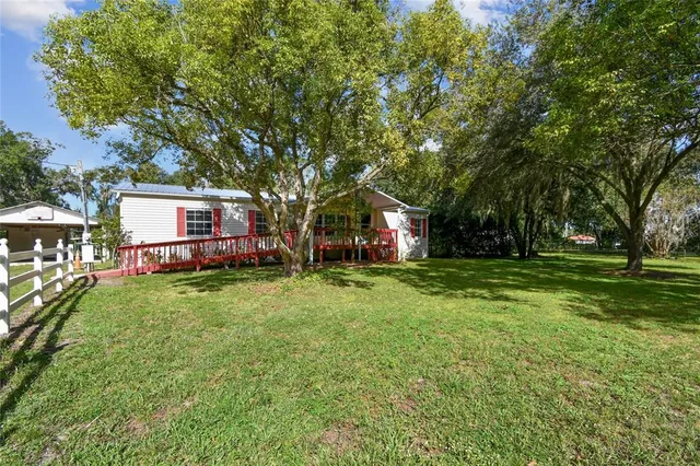 a view of balcony with wooden floor and outdoor space