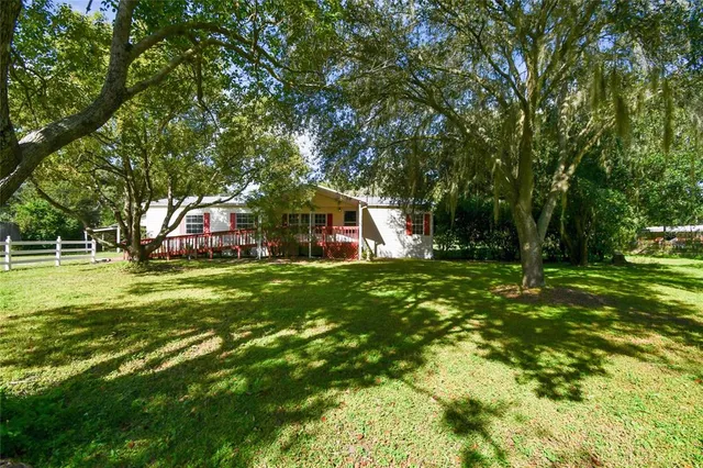 a view of a balcony with wooden floor