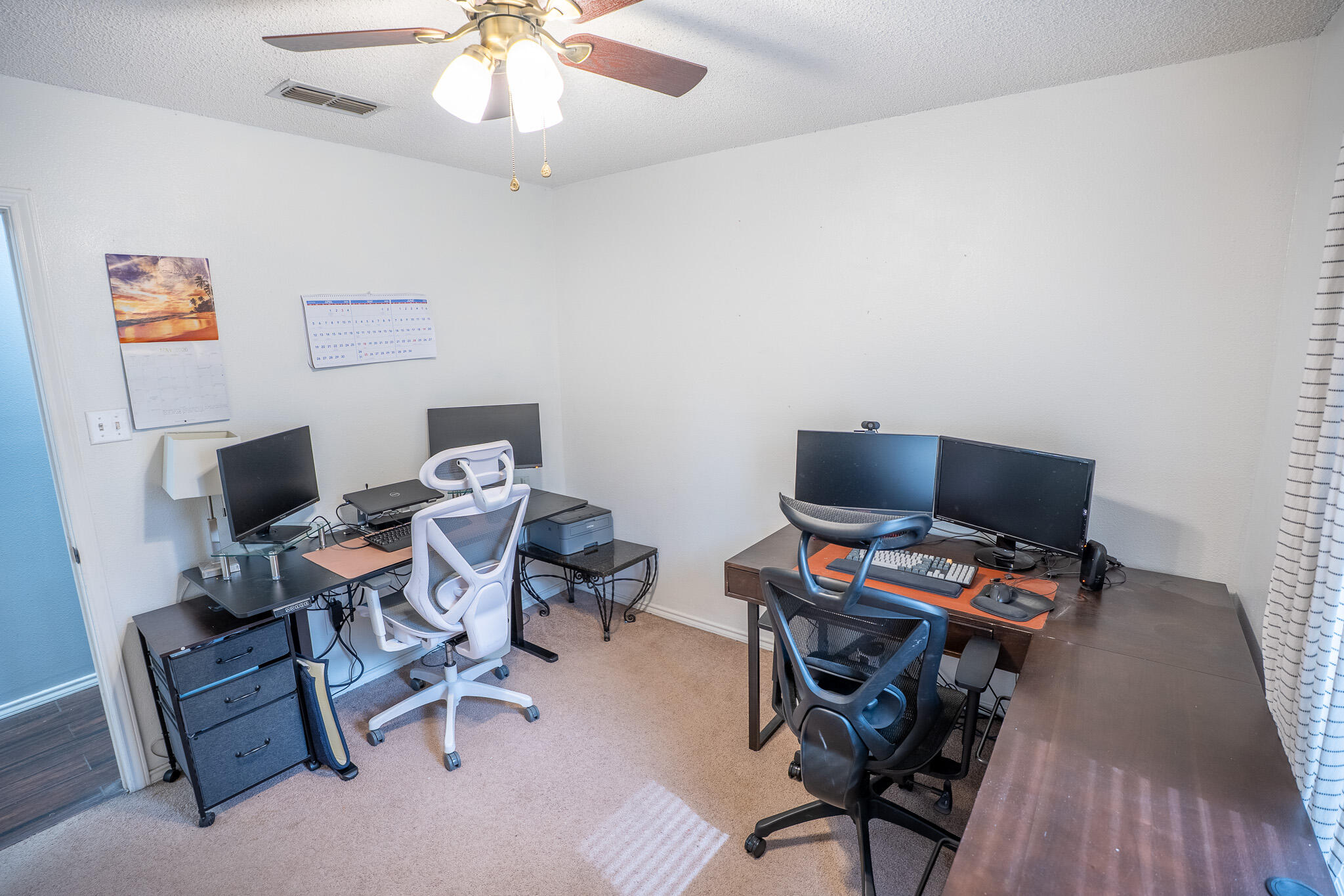 1609 78th Street Lubbock, TX 79423 - Photo 23 of 36 a workspace with furniture and wooden floor
