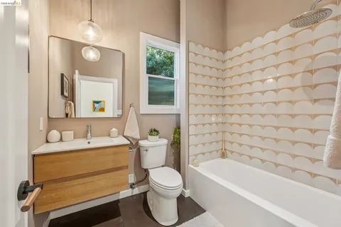 a bathroom with a toilet a sink and bathtub