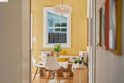 a dining room with furniture and window