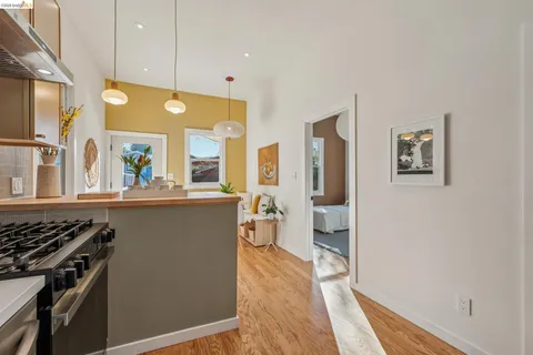 a kitchen with stainless steel appliances a stove and a refrigerator