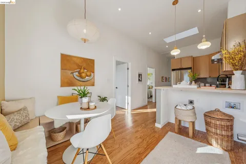 a living room with kitchen island furniture and a wooden floor