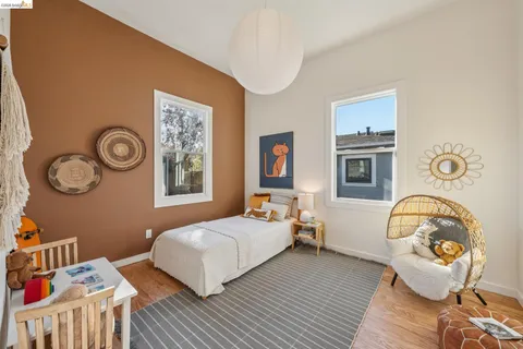 a bedroom with bed and a window