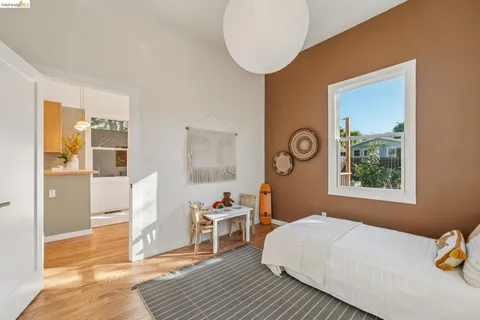 a bedroom with a bed and a table in it